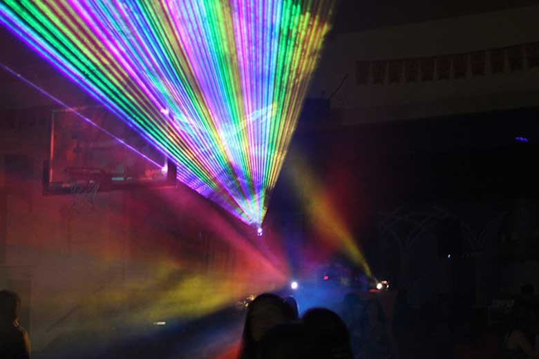 School Laser Light Show, DJ Ancaster, School dance with fan of multi color beams coming from the laser light show. Taken in Ancaster Ontario.